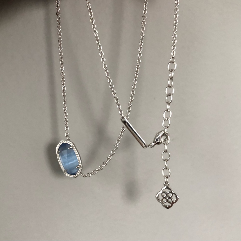 Light blue pendant on silver chain